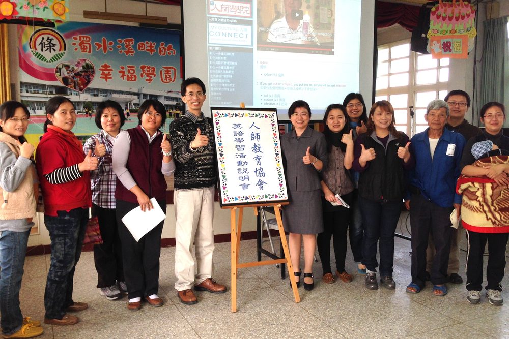 Community members at an MCC information session giving a thumbs-up